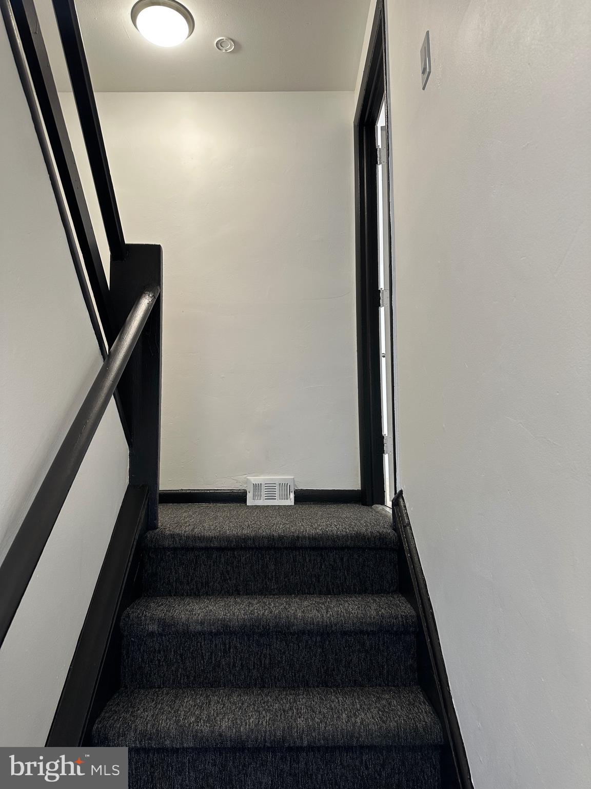 9405 Kirkwood Road Philadelphia, PA 19114 - Photo 6 of 66 a view of staircase with white walls and a window