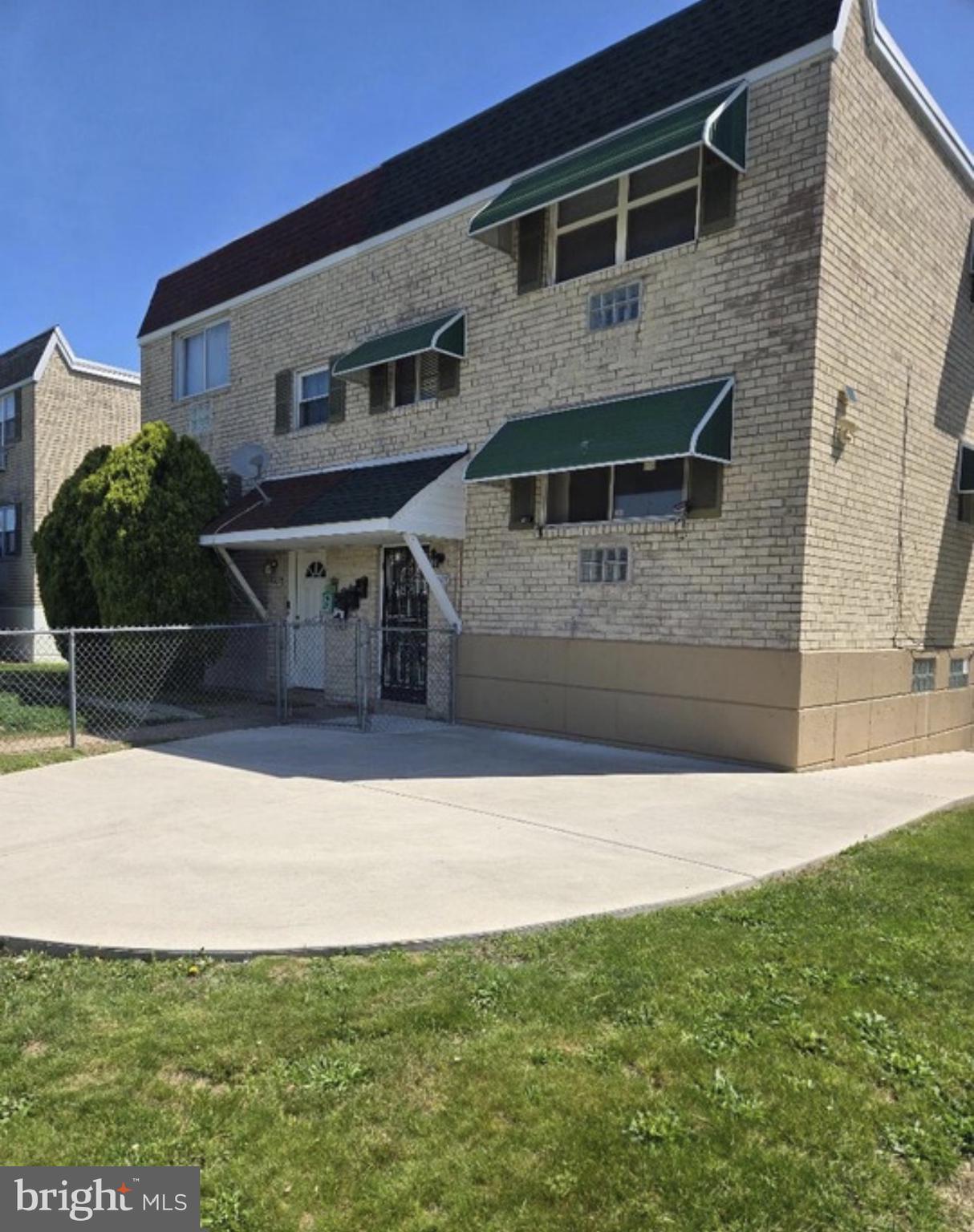 9405 Kirkwood Road Philadelphia, PA 19114 - Photo 64 of 66 a front view of a house with a yard