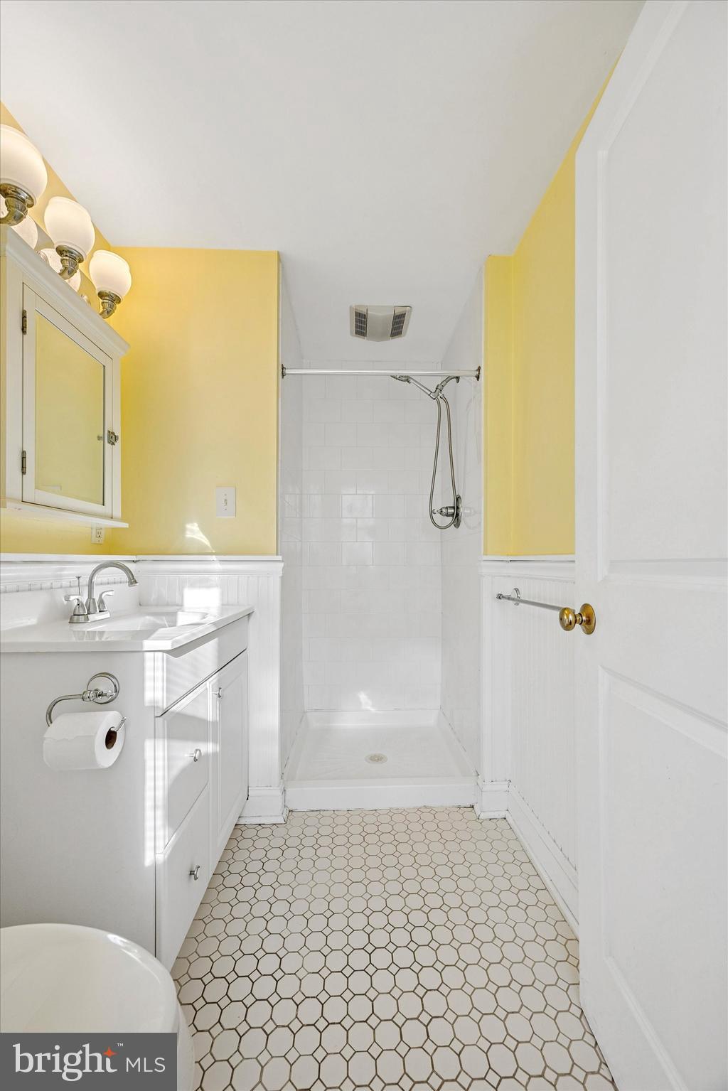 5449 Ridge Avenue, Unit 2 Philadelphia, PA 19128 - Photo 14 of 15 a bathroom with a sink a toilet and shower