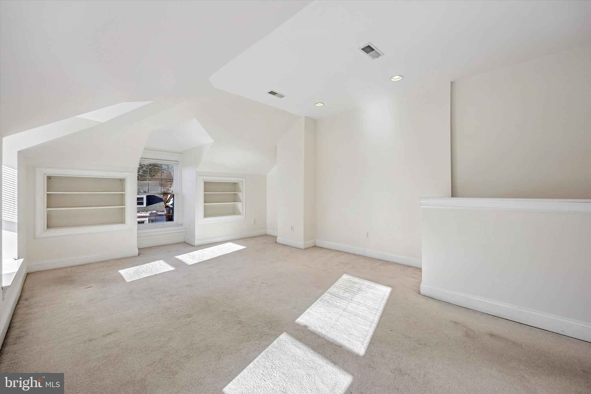 5449 Ridge Avenue, Unit 2 Philadelphia, PA 19128 - Photo 6 of 15 an empty room with furniture and window