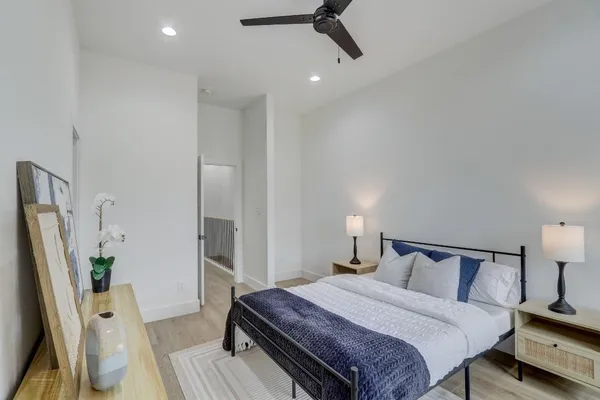 a bedroom with a bed and a flat screen tv