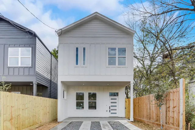 a front view of a house with a garage