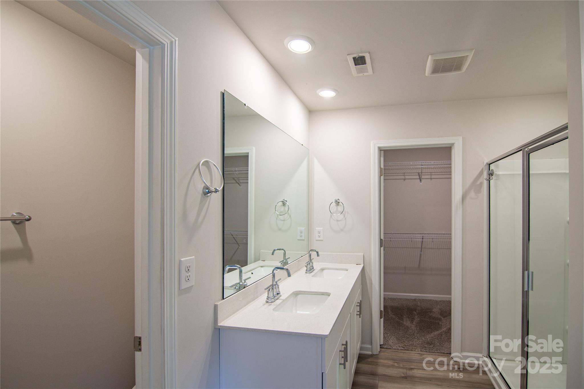 1148 Harland Street, Unit 52 Charlotte, NC 28216 - Photo 12 of 26 a bathroom with a sink a toilet and shower