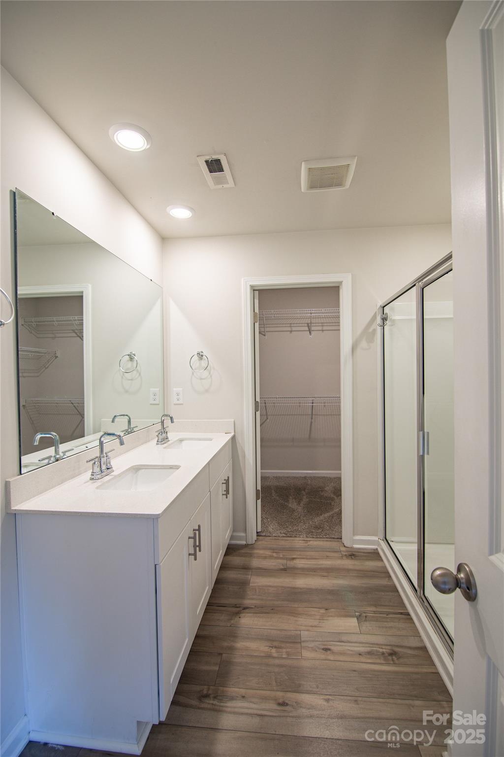 1148 Harland Street, Unit 52 Charlotte, NC 28216 - Photo 13 of 26 a bathroom with a double vanity sink and mirror