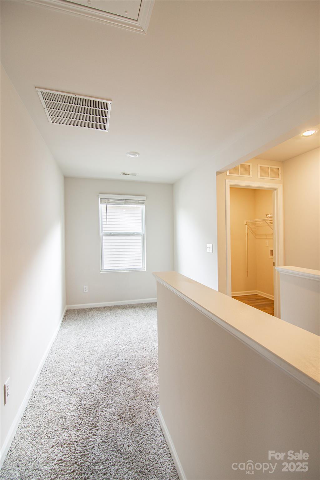 1148 Harland Street, Unit 52 Charlotte, NC 28216 - Photo 21 of 26 a view of an empty room with window