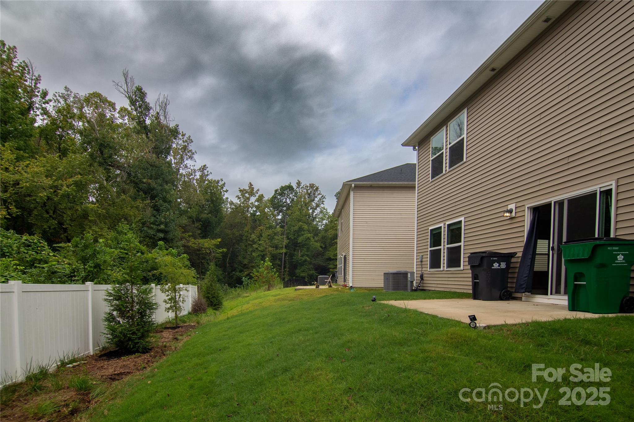 1148 Harland Street, Unit 52 Charlotte, NC 28216 - Photo 23 of 26 a view of house with backyard