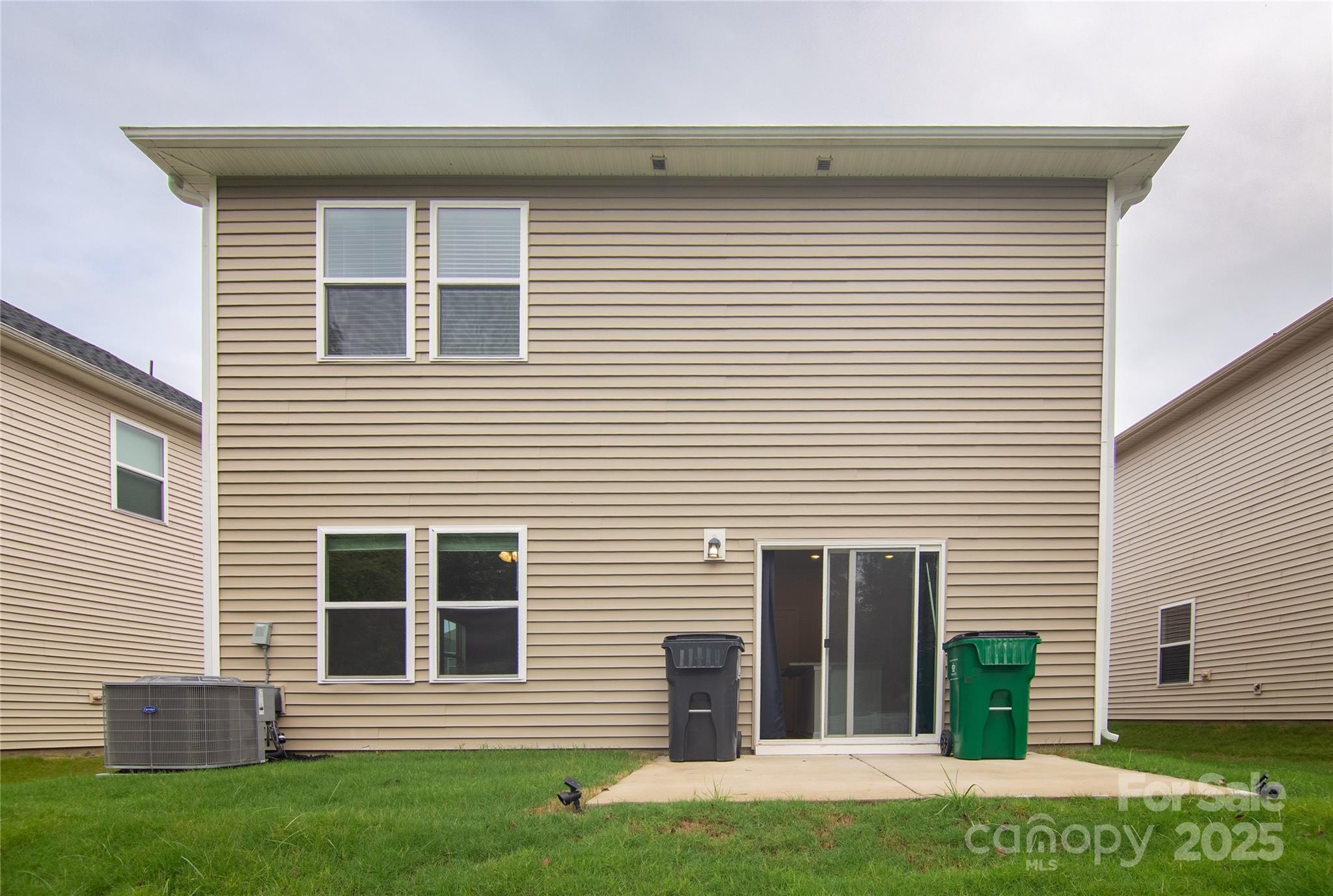1148 Harland Street, Unit 52 Charlotte, NC 28216 - Photo 24 of 26 a front view of a house with a yard