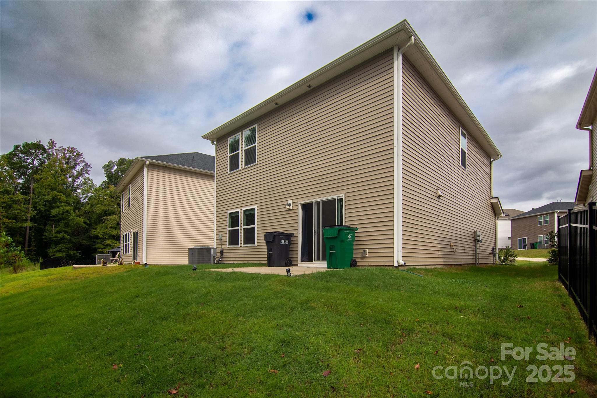 1148 Harland Street, Unit 52 Charlotte, NC 28216 - Photo 25 of 26 a front view of house with yard and green space