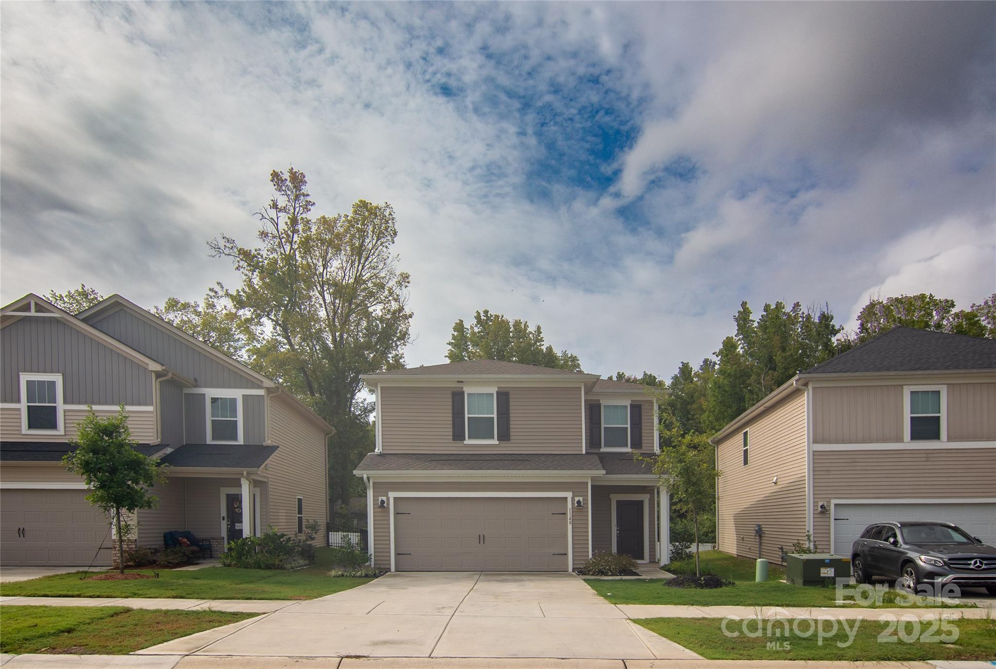 1148 Harland Street, Unit 52 Charlotte, NC 28216 - Photo 26 of 26 a front view of house with yard and green space