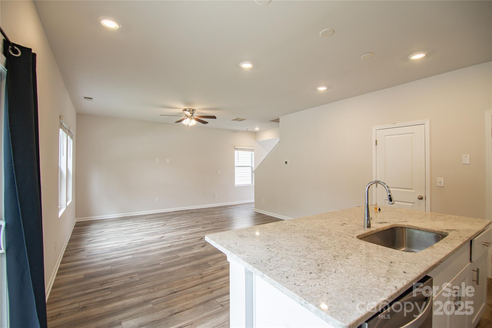 1148 Harland Street, Unit 52 Charlotte, NC 28216 - Photo 7 of 26 a kitchen with a sink dishwasher and a refrigerator