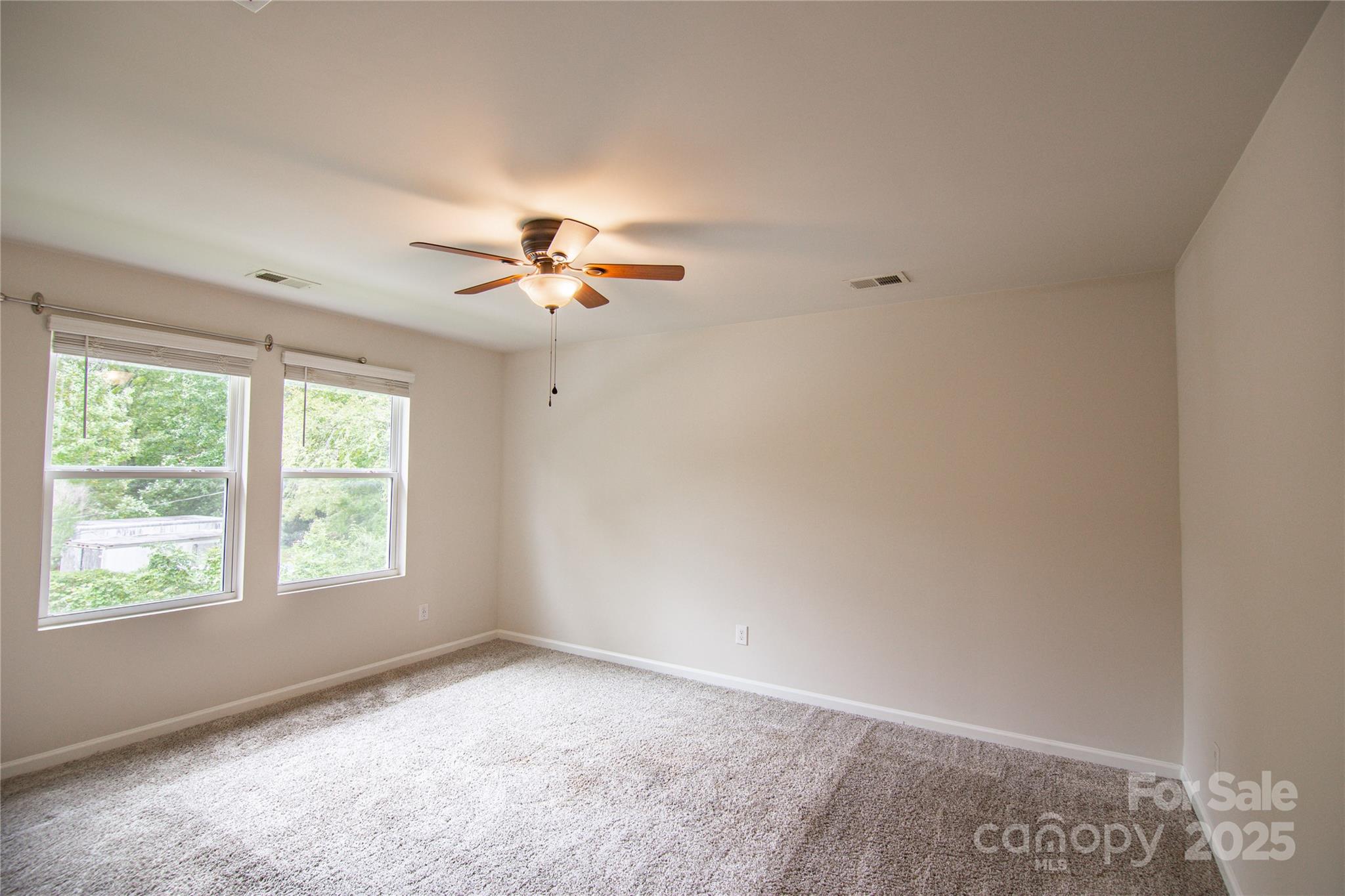 1148 Harland Street, Unit 52 Charlotte, NC 28216 - Photo 8 of 26 an empty room with a window