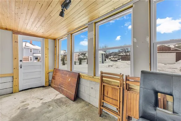 a view of a livingroom with furniture and windows