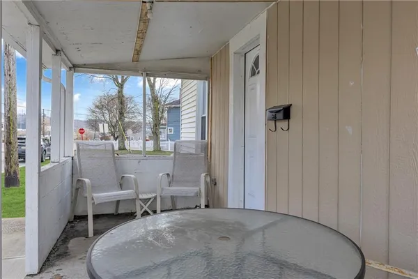 a living room with furniture a table and chairs