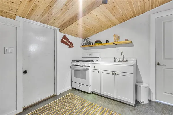 a kitchen with appliances cabinets and a counter top space
