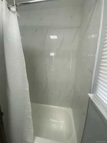 a view of a bathtub in a bathroom