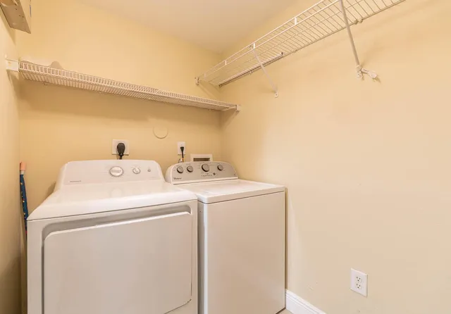 a view of kitchen with kitchen island microwave and stove