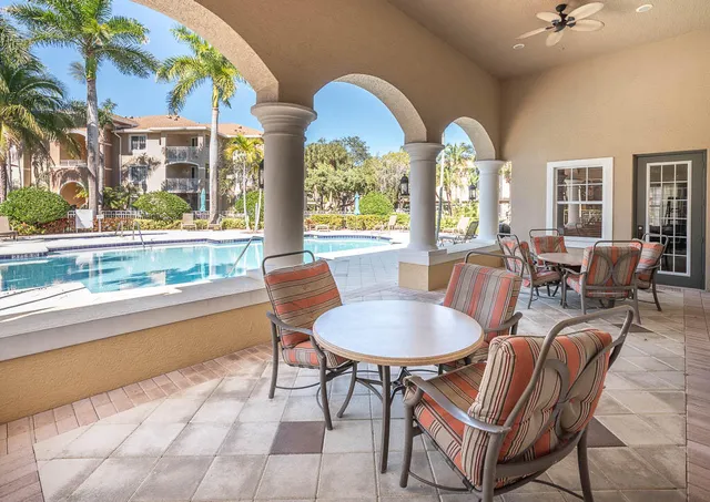 a view of a swimming pool with a patio