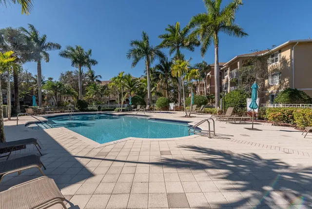a view of a backyard with a sitting area