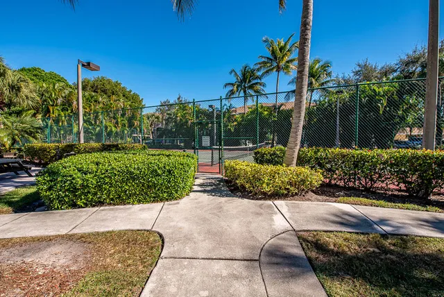 a view of a playground with basketball court