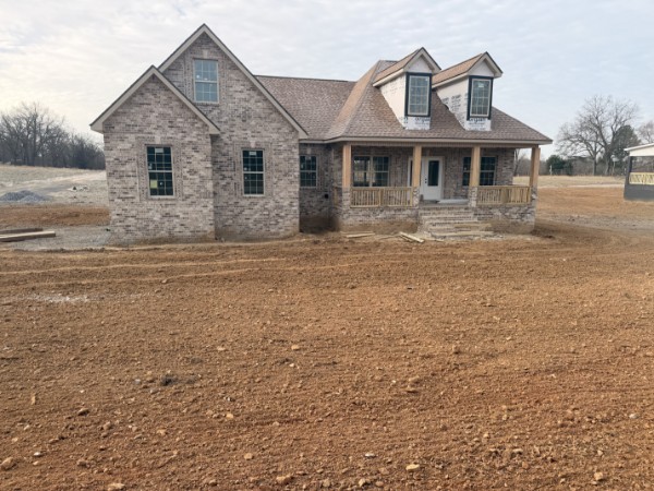 531 Old Hopkinsville Road Cadiz, KY 42211 - Photo 1 of 15 a front view of a house with a garden