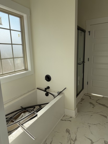 531 Old Hopkinsville Road Cadiz, KY 42211 - Photo 10 of 15 a bathroom with a tub and a window