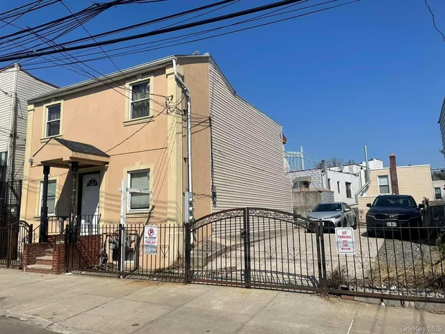 a view of a house with a parking area