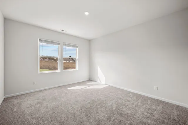 an empty room with windows