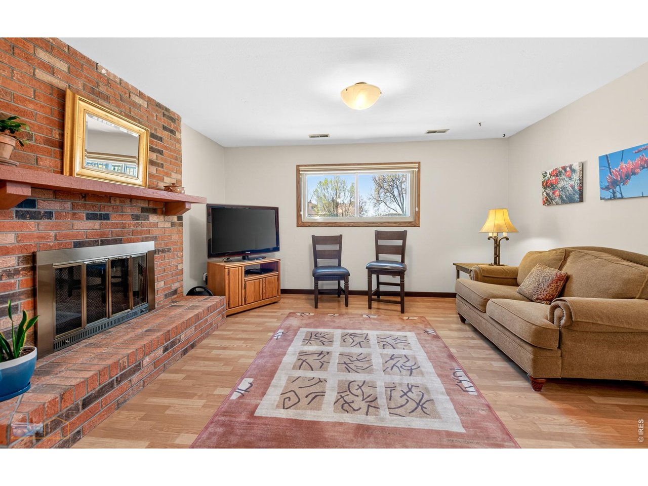 3978 Viewpoint Way Lafayette, CO 80026 - Photo 24 of 41 Lower level family room/ hobby room with gas fireplace