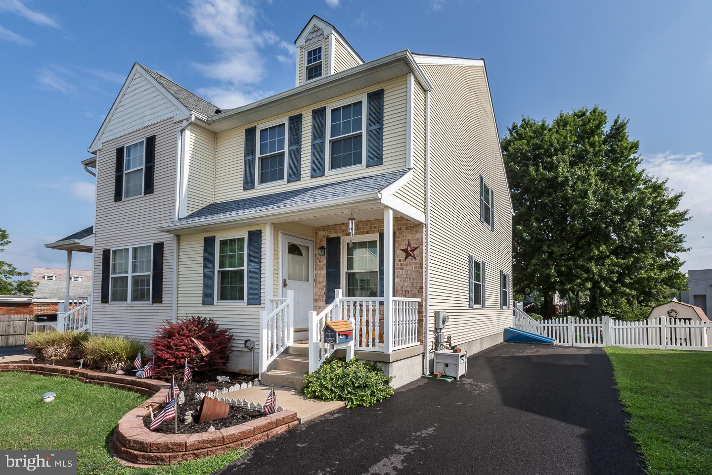 1941 Oak Leaf Lane Holmes, PA 19043 - Photo 1 of 44 a front view of a house with a yard and garage
