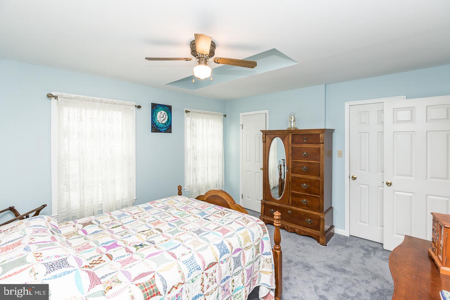 1941 Oak Leaf Lane Holmes, PA 19043 - Photo 15 of 44 a bedroom with a bed and a chandelier