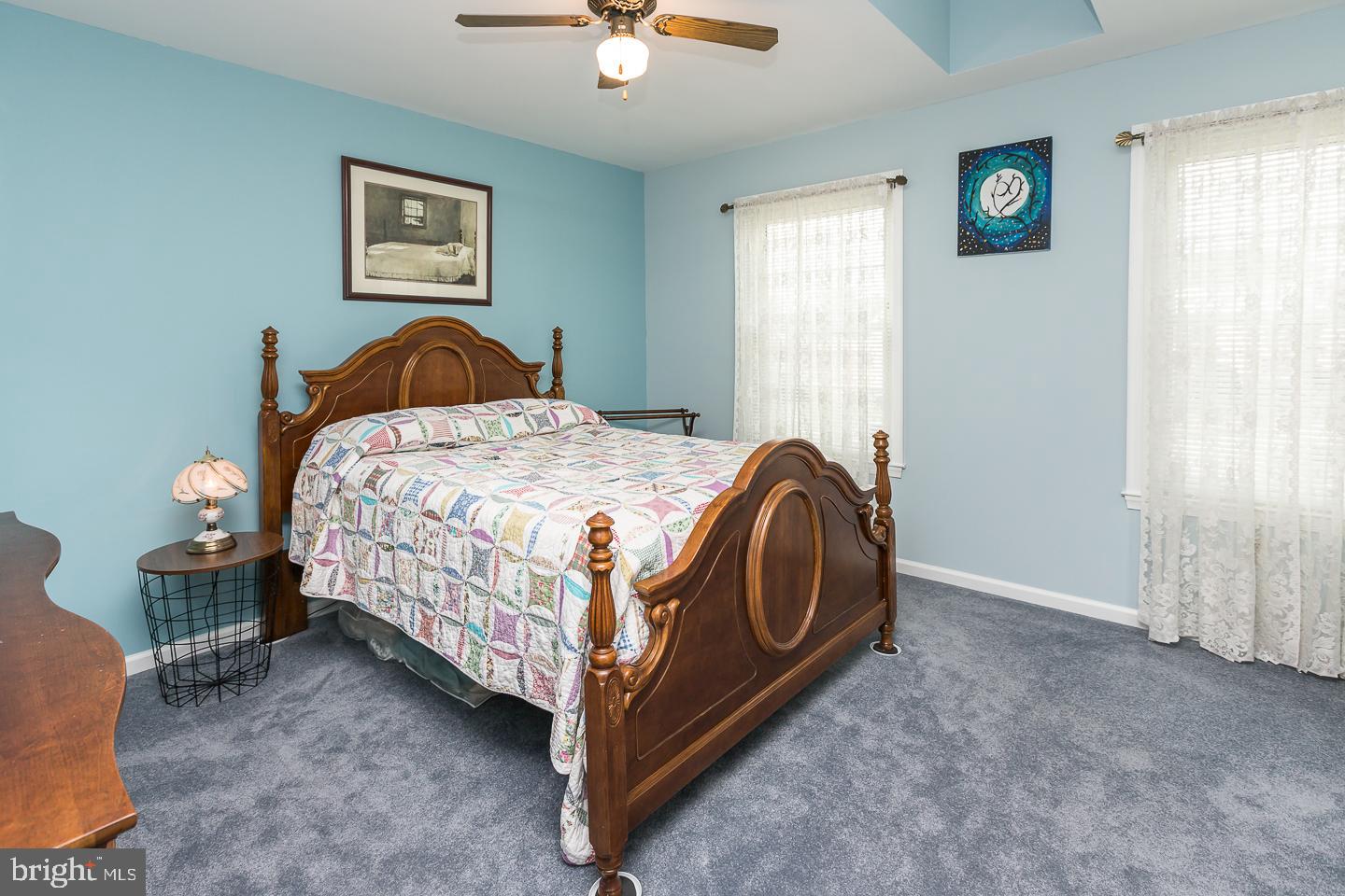 1941 Oak Leaf Lane Holmes, PA 19043 - Photo 19 of 44 a bedroom with a bed lamp and a window