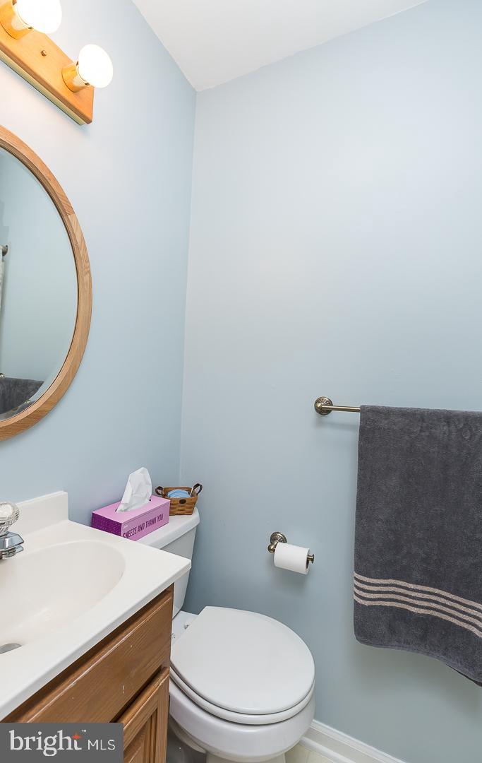 1941 Oak Leaf Lane Holmes, PA 19043 - Photo 22 of 44 a bathroom with a sink a toilet and a mirror