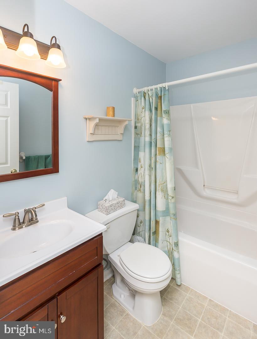 1941 Oak Leaf Lane Holmes, PA 19043 - Photo 27 of 44 a bathroom with a sink a toilet and shower