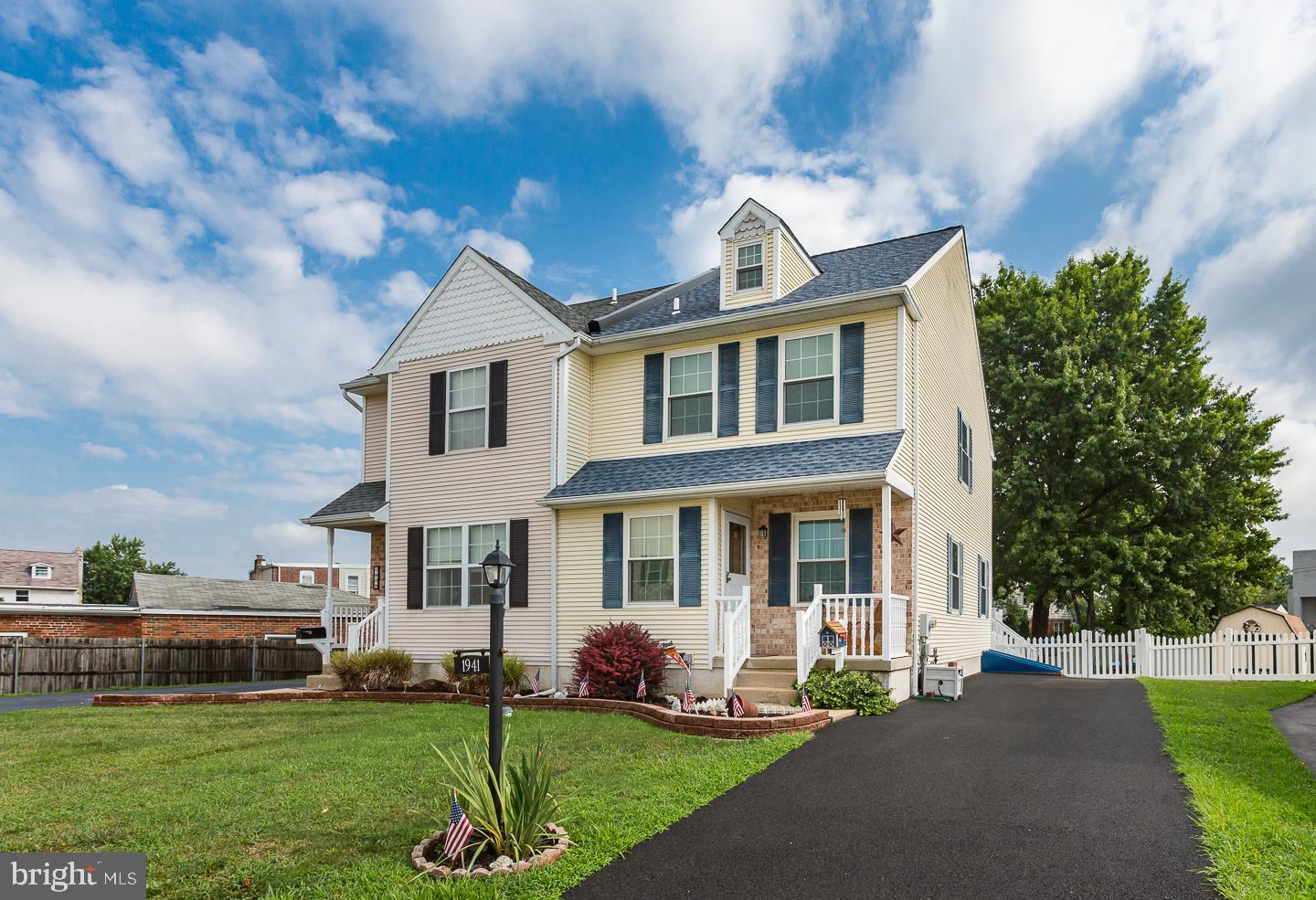 1941 Oak Leaf Lane Holmes, PA 19043 - Photo 4 of 44 a front view of a house with a garden and yard