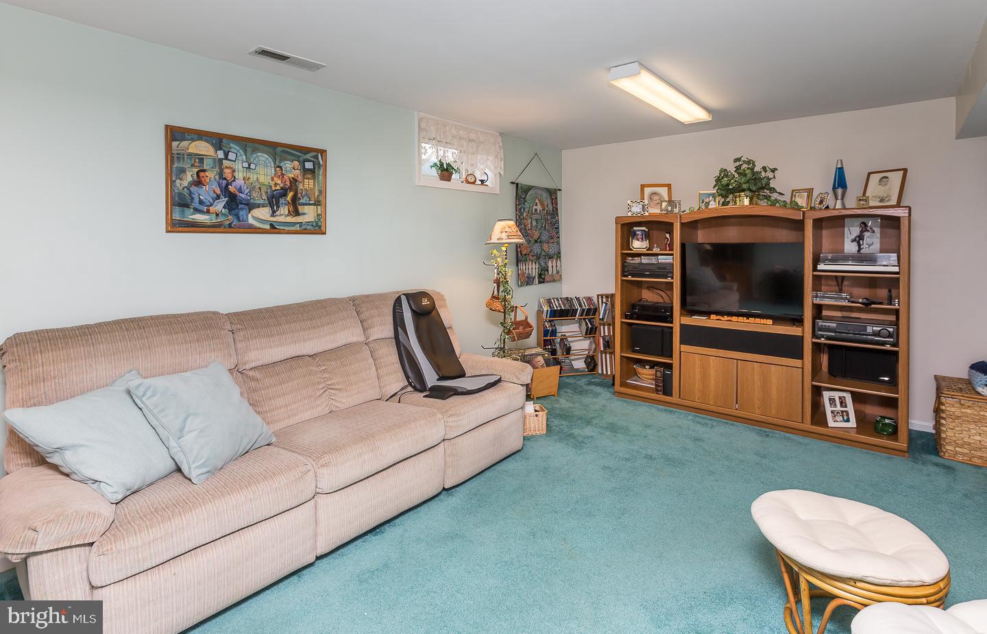 1941 Oak Leaf Lane Holmes, PA 19043 - Photo 32 of 44 a living room with furniture and a flat screen tv