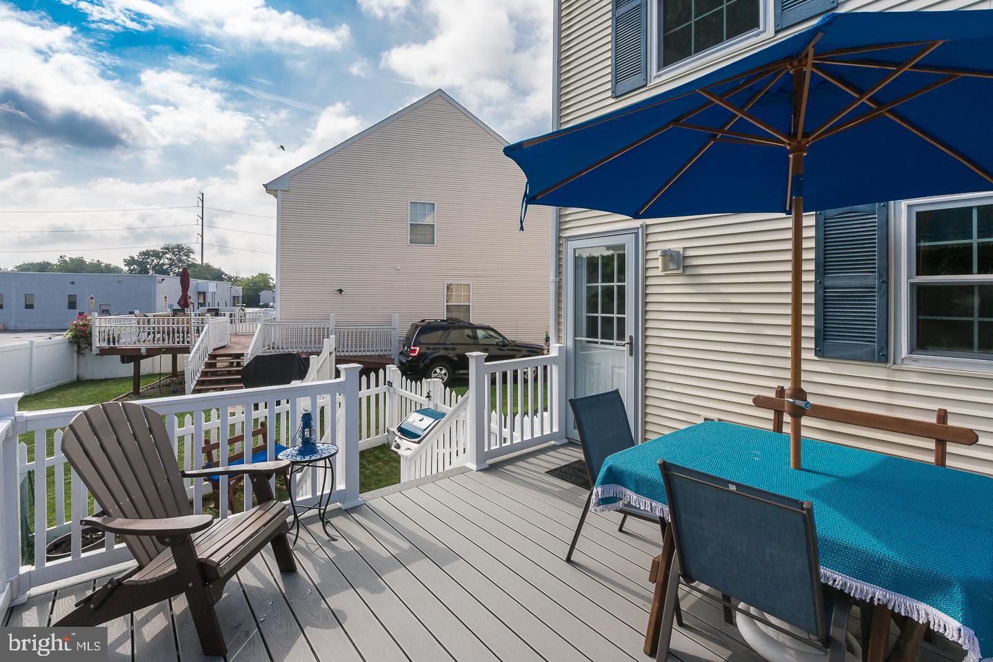 1941 Oak Leaf Lane Holmes, PA 19043 - Photo 38 of 44 a roof deck with a table and chairs