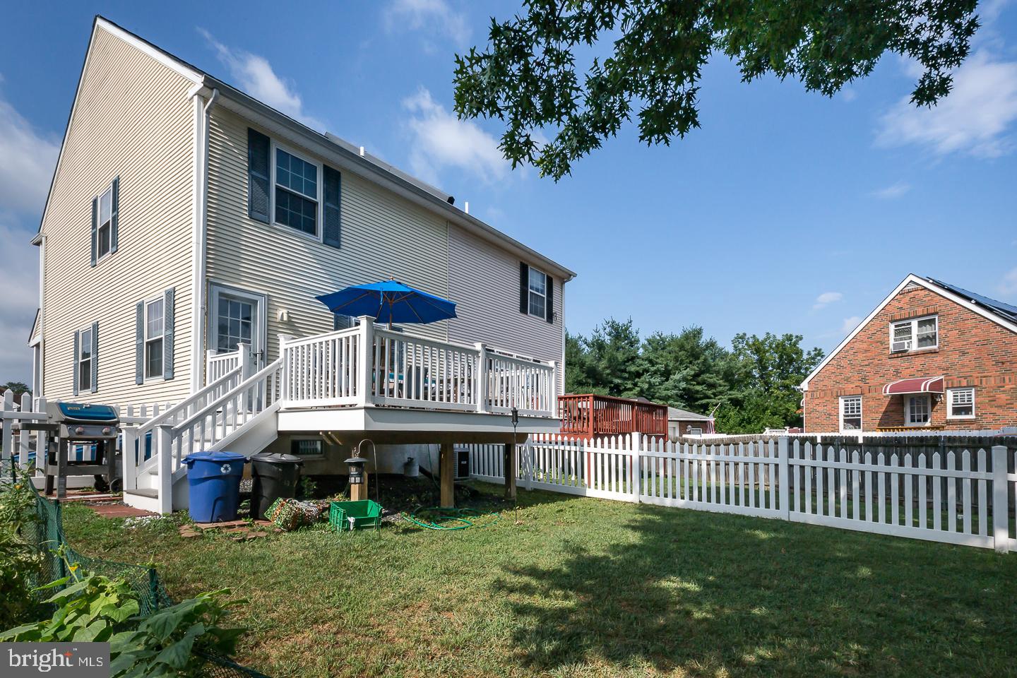 1941 Oak Leaf Lane Holmes, PA 19043 - Photo 42 of 44 a view of a house with a small yard and a large tree