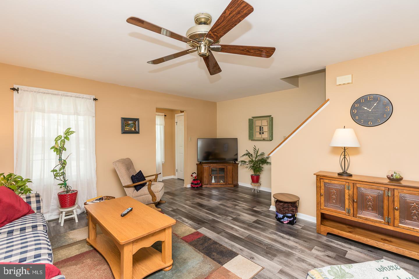 1941 Oak Leaf Lane Holmes, PA 19043 - Photo 7 of 44 a living room with furniture a rug and a chandelier