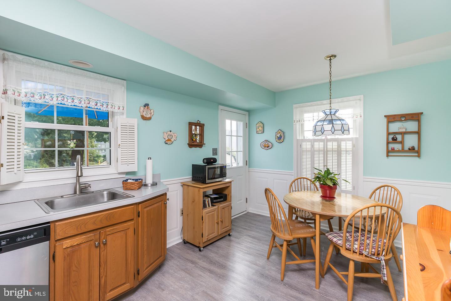 1941 Oak Leaf Lane Holmes, PA 19043 - Photo 10 of 44 a kitchen that has a dining table wooden floor and a window