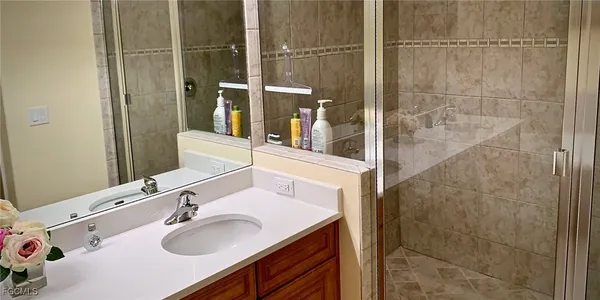 a bathroom with a sink and a mirror