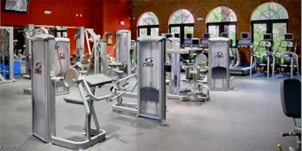 a view of a patio with chairs and a table