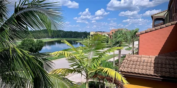 a view of a lake with a yard