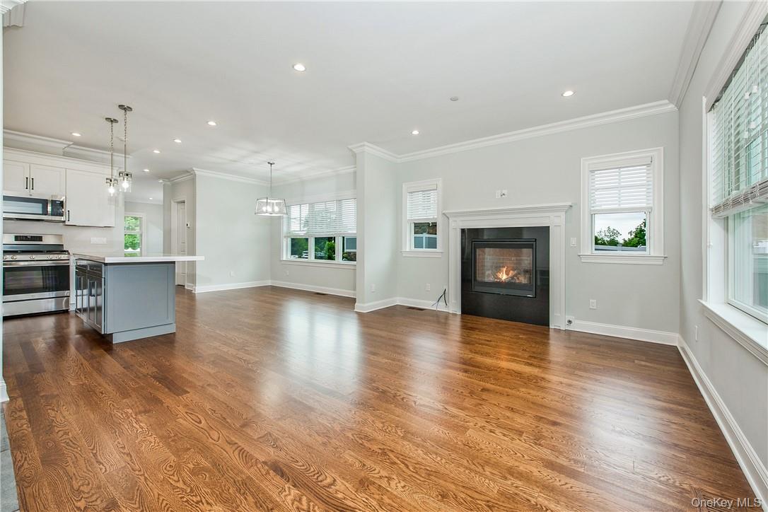 124 B Maple Avenue Rye, NY 10580 - Photo 4 of 27 VIEW SHOWING OPEN-CONCEPT OF KITCHEN, DINING ROOM AND FAMILY ROOM WITH GAS-FIRED FIREPLACE