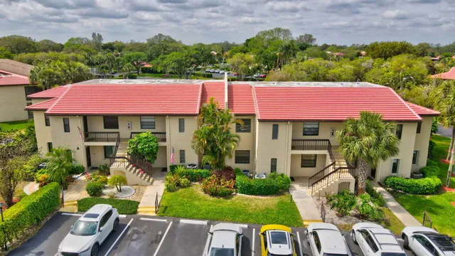 an aerial view of a house with a swimming pool yard and outdoor seating