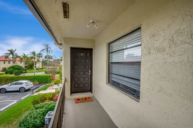 a view of a room with window and flower pot