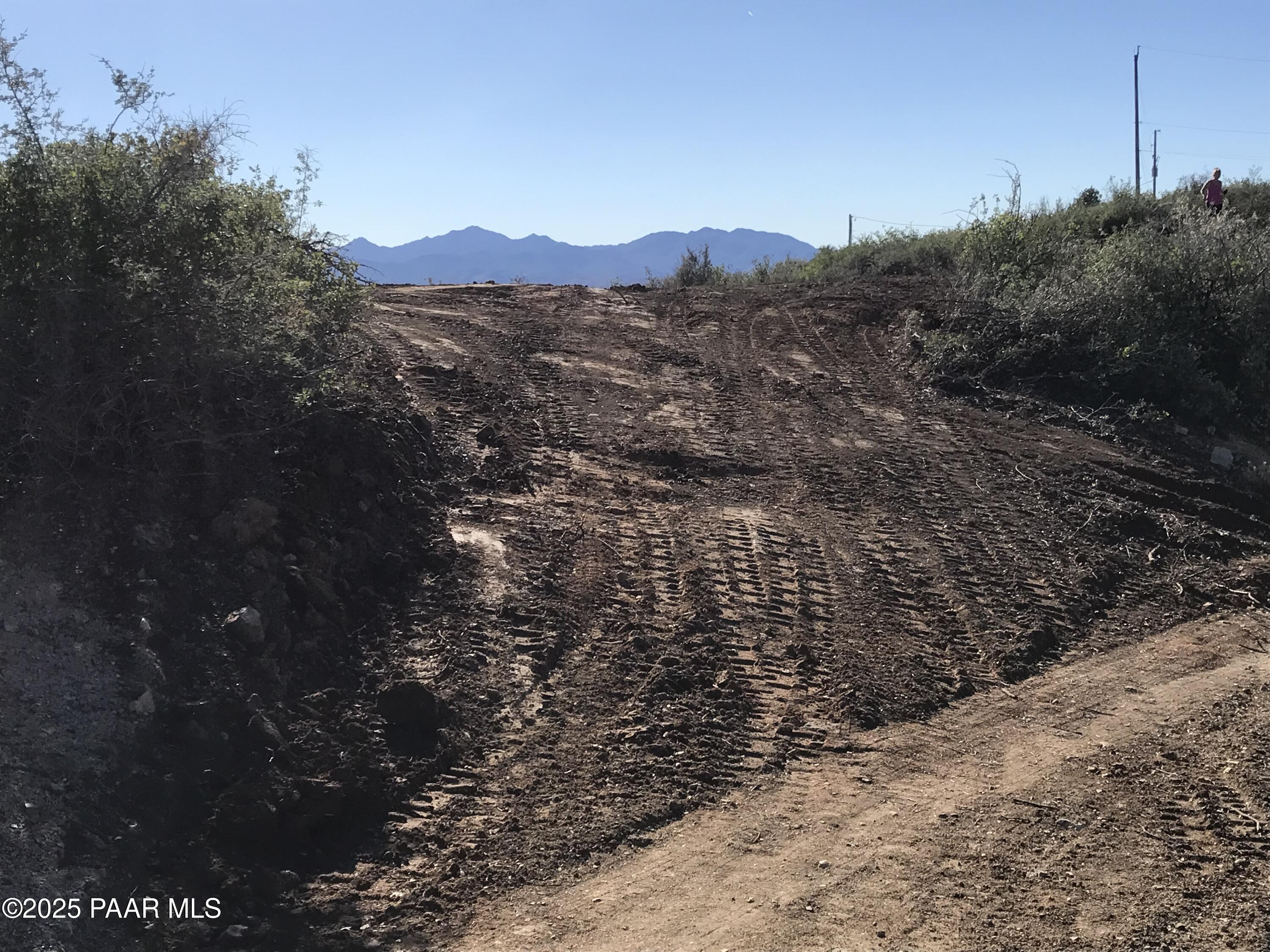 8335 West Barrington Road Wilhoit, AZ 86332 - Photo 11 of 13 a view of a house with a mountain