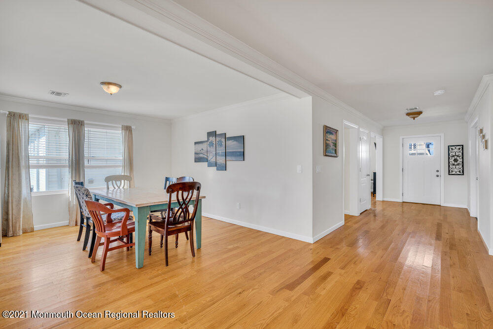 32 Niblick Street Point Pleasant Beach, NJ 08742 - Photo 16 of 38 a view of a dining room with furniture and chandelier