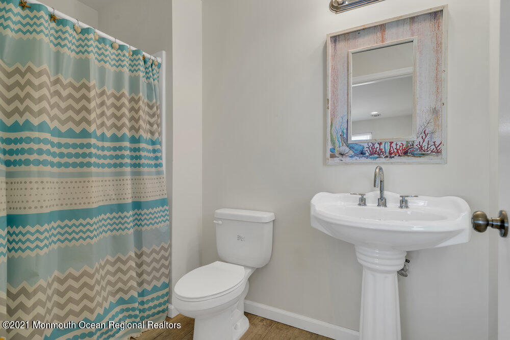 32 Niblick Street Point Pleasant Beach, NJ 08742 - Photo 25 of 38 a bathroom with a sink toilet and shower