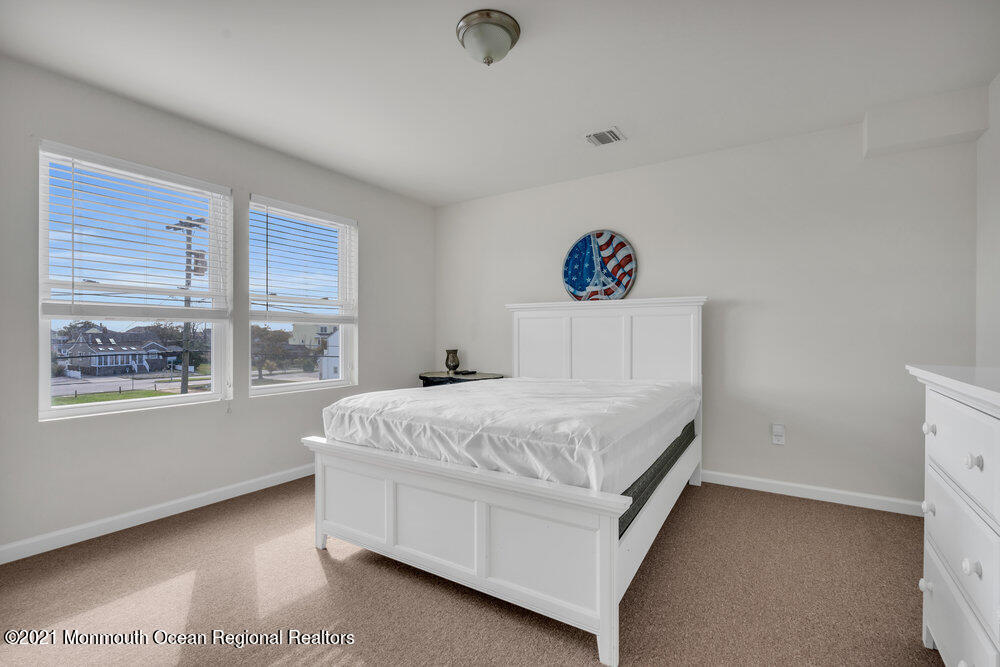 32 Niblick Street Point Pleasant Beach, NJ 08742 - Photo 28 of 38 a bedroom with a bed and a window