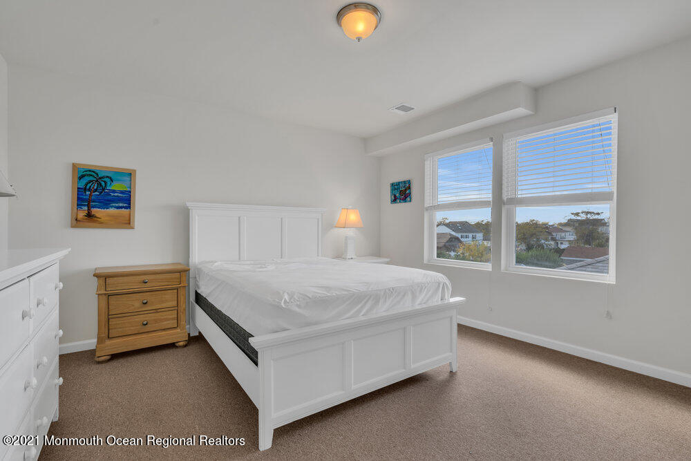 32 Niblick Street Point Pleasant Beach, NJ 08742 - Photo 29 of 38 a bedroom with a bed and window